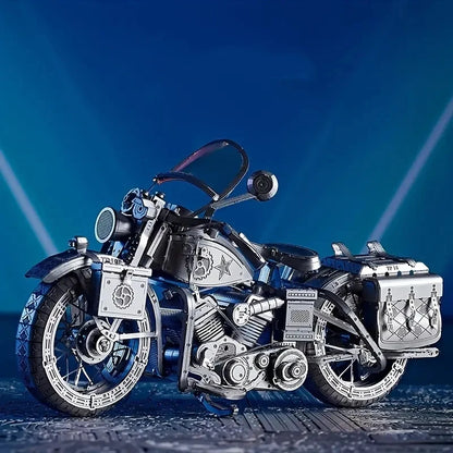 A sleek, assembled 3D metal puzzle of a Harley-style cruiser motorcycle, reflecting light off its polished stainless steel surfaces.