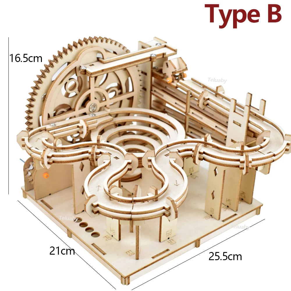 Two versions of Chriyungel mechanical marble runs: a large complex tower and a compact desktop version, both made of laser-cut wood with steel marbles.