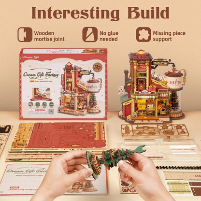 A completed ROKR Christmas Dream Gift Factory mechanical music box, showing moving wooden gears and festive holiday details in a warm, lit setting