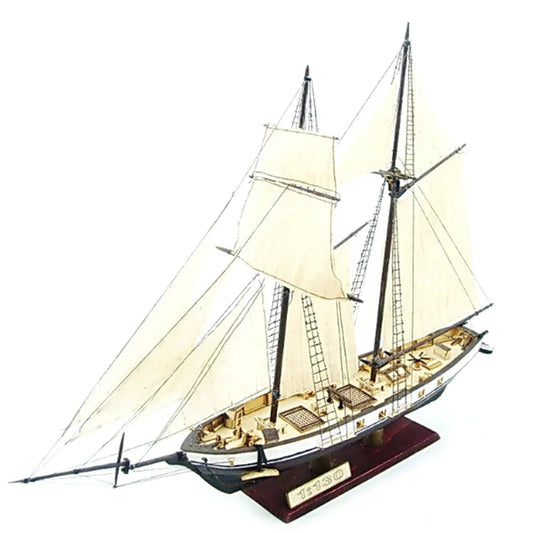 A detailed 1:130 scale classical wooden sailing ship model with white sails and intricate rigging, displayed as premium home office decor.
