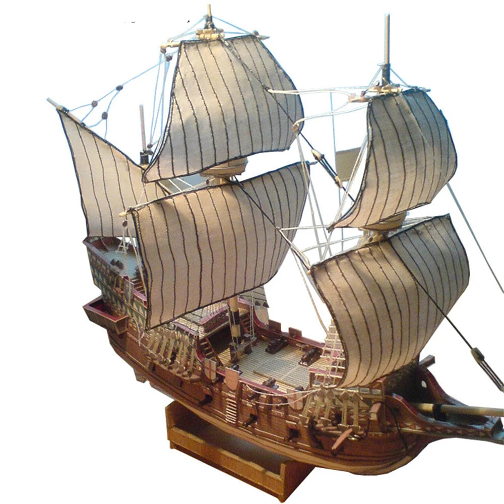 A professional completed paper model of the Golden Hind galeon at 1:100 scale, showcasing realistic paper textures and historical naval rigging.