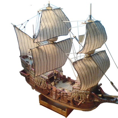A professional completed paper model of the Golden Hind galeon at 1:100 scale, showcasing realistic paper textures and historical naval rigging.