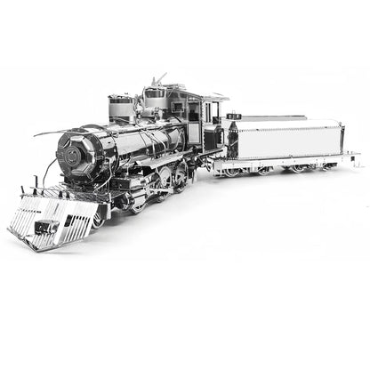 A finished stainless steel 3D metal puzzle of a classic steam locomotive with intricate gear and wheel details, shining under a desk lamp.