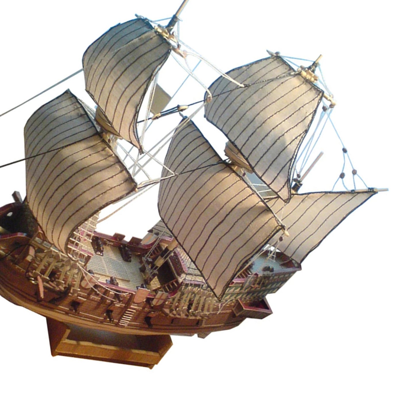 A professional completed paper model of the Golden Hind galeon at 1:100 scale, showcasing realistic paper textures and historical naval rigging.