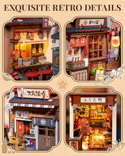 A completed Robotime Sakura Wine Alley Book Nook glowing with warm LED lights between books on a shelf, showing a detailed Japanese miniature street.