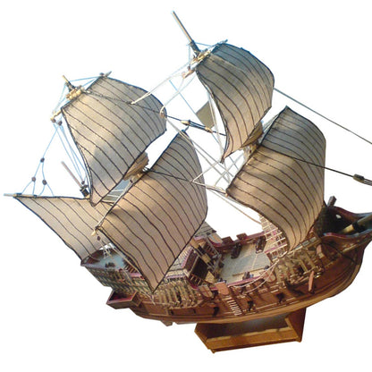 A professional completed paper model of the Golden Hind galeon at 1:100 scale, showcasing realistic paper textures and historical naval rigging.
