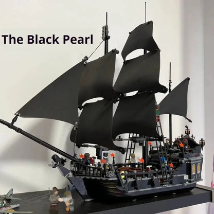Detailed Black Pearl pirate ship building block model with black sails and over 800 pieces, displayed as a premium collector masterpiece.