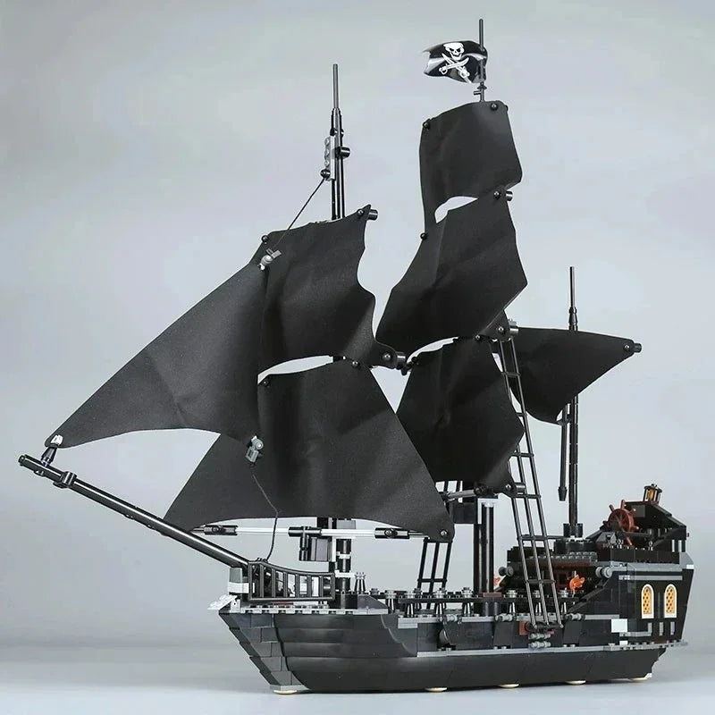 Detailed Black Pearl pirate ship building block model with black sails and over 800 pieces, displayed as a premium collector masterpiece.