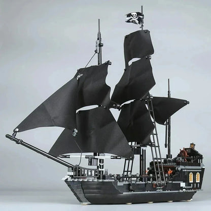 Detailed Black Pearl pirate ship building block model with black sails and over 800 pieces, displayed as a premium collector masterpiece.